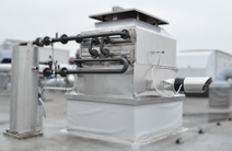 Placing the exhaust gas exchanger on the roof before insulating the connection kits.