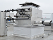 Placing the exhaust gas exchanger on the roof before insulating the connection kits.